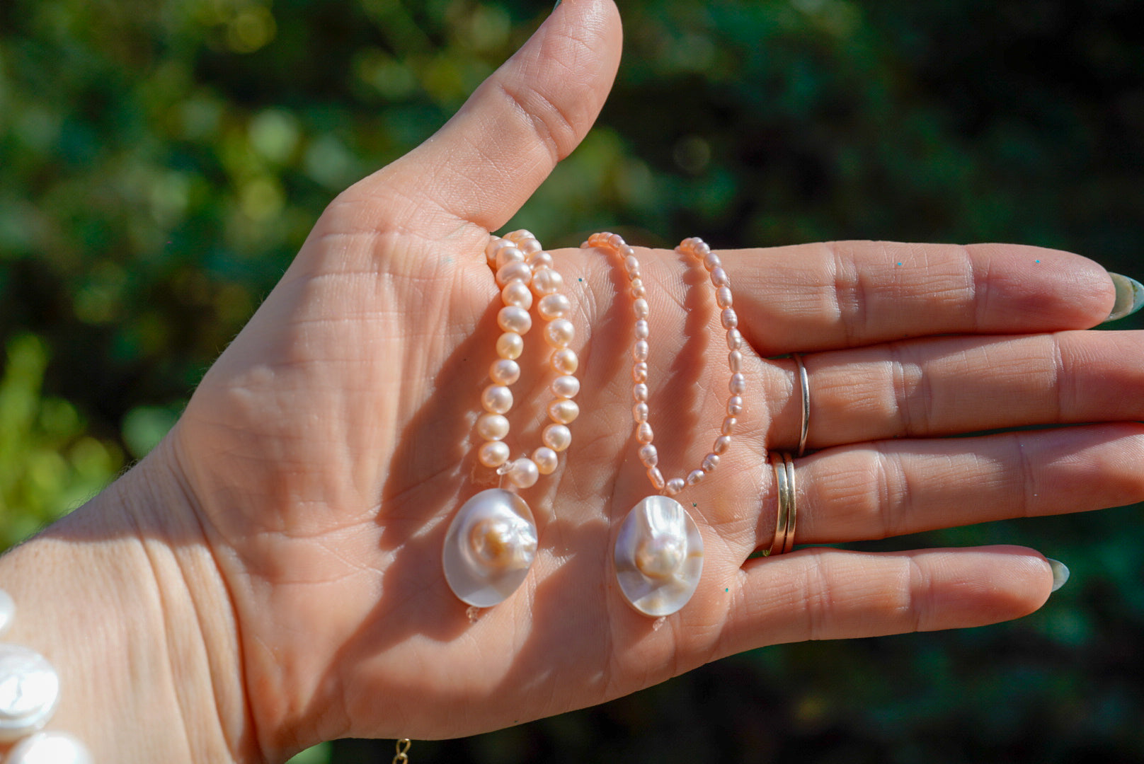 Arwen’s Pearl “Locket” necklace made with mother of pearl.