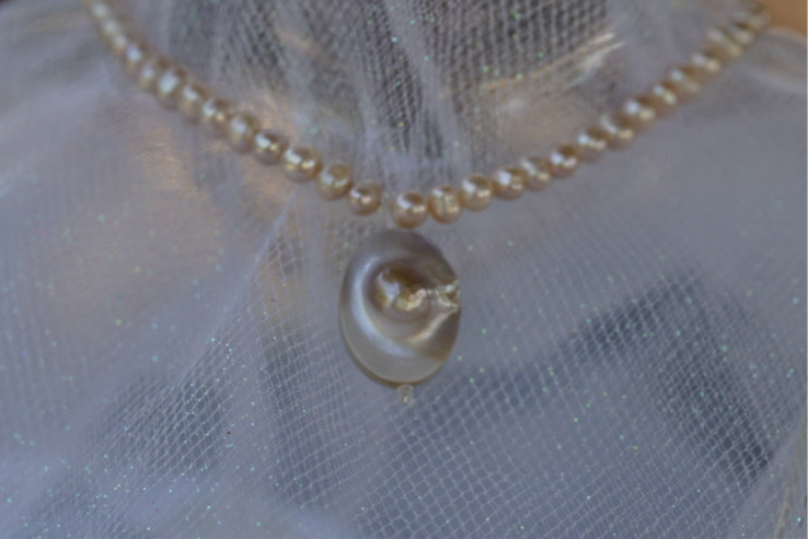 Arwen’s Pearl “Locket” necklace made with mother of pearl.